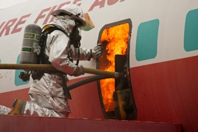 Firefighter training on extinguishing a fire inside an air plane fuselage.